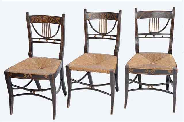 Appraisal: A SET OF THREE REGENCY EBONISED AND RUSH SEATED DINING