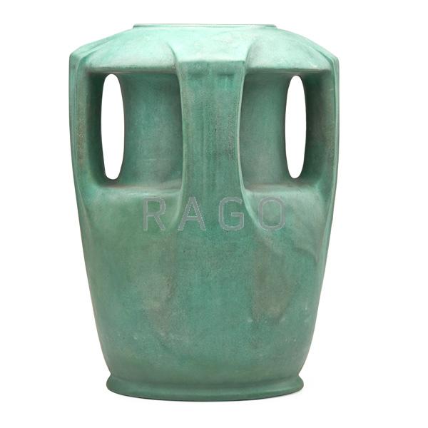 Appraisal: TECO Large buttressed vase Condition Report Professional restoration to body