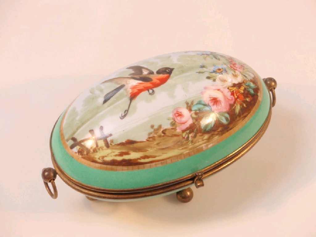 Appraisal: A French porcelain casket ovoid the cover painted with a