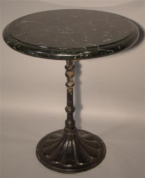 Appraisal: VICTORIAN CAST IRON AND MARBLE TOP CAFE TABLE The molded