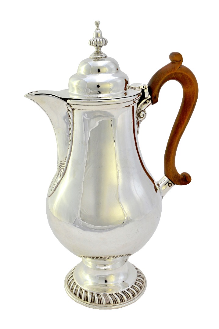 Appraisal: A silver hot water jug of baluster form on a