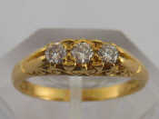 Appraisal: An carat gold diamond three stone ring the round brilliant