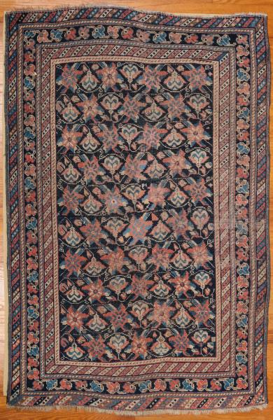 Appraisal: A HAND MADE SEMI ANTIQUE CAUCASIAN SCATTER RUGThe field of