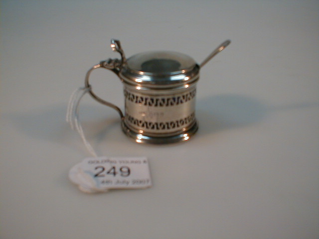 Appraisal: A Victorian silver drum mustard with pierced body and blue