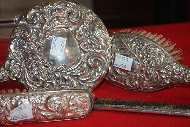 Appraisal: A SILVER BACKED DRESSING TABLE SET comprising two brushes a