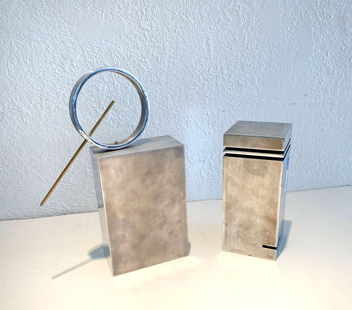 Appraisal: MODERNIST BRASS AND STEEL SCULPTURES Rectangular Block Form with Ring