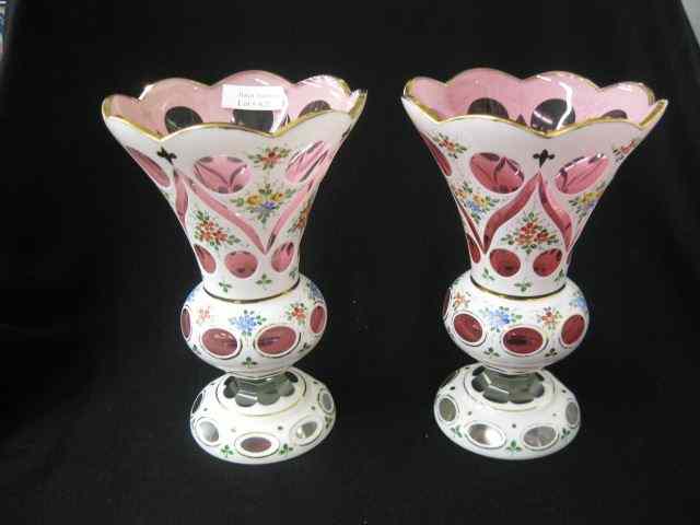 Appraisal: Pair of Bohemian Cased Cut Back Vases enameled white floral