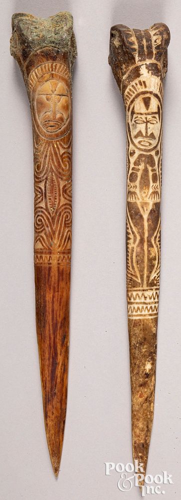 Appraisal: Two Papua New Guinea carved bone daggers Two Papua New