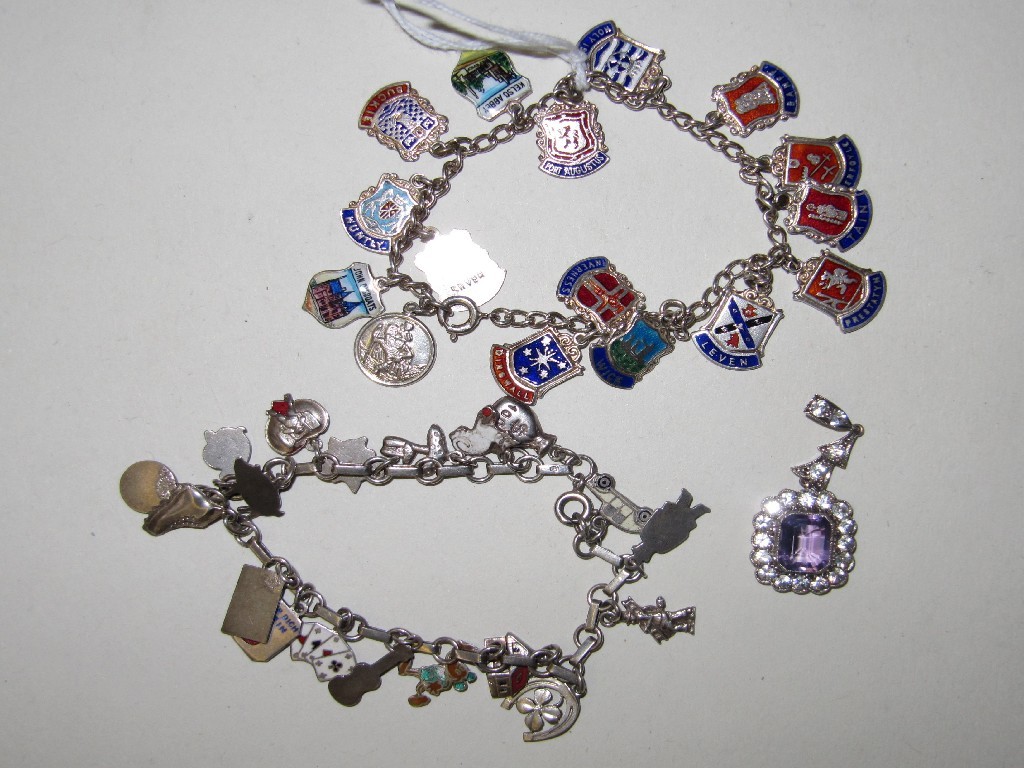 Appraisal: Lot comprising two silver charm bracelets and a pendant