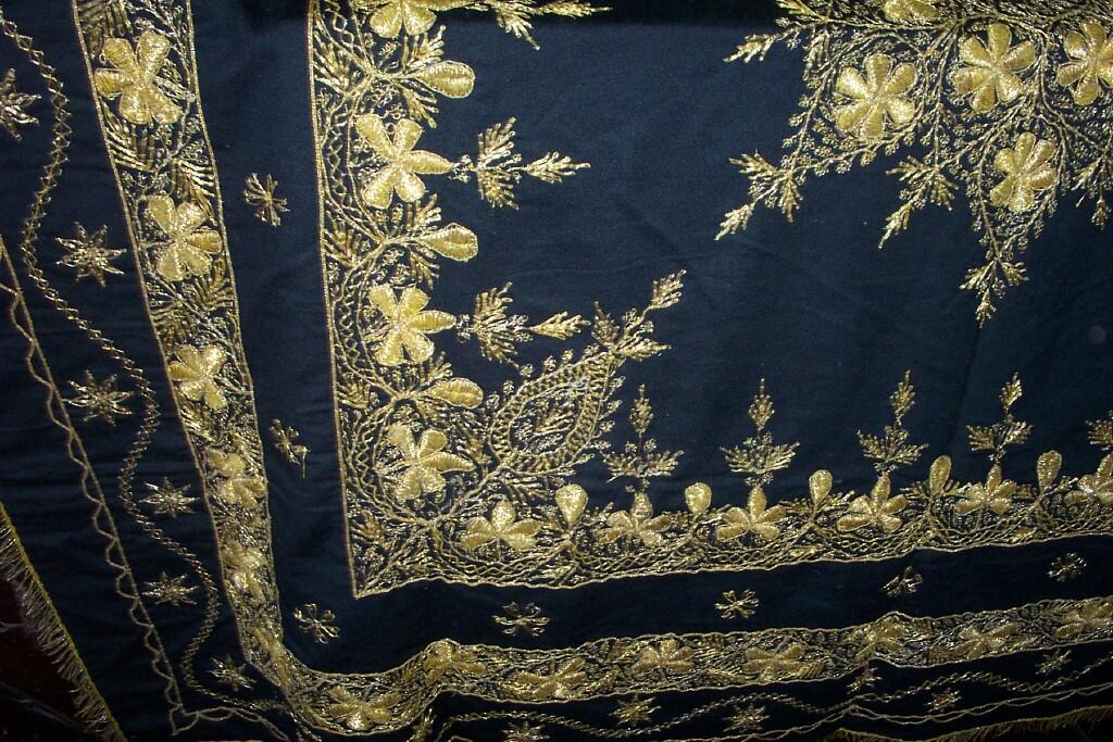 Appraisal: A black ground Eastern panel with elaborate gold thread work