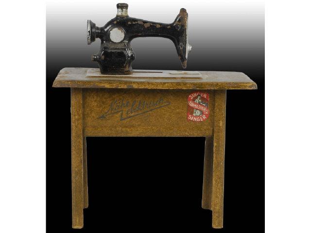 Appraisal: Tin Singer Electric Sewing Machine Still Bank Description Made in