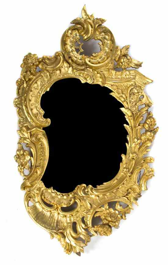 Appraisal: A Louis XV Style Giltwood Mirror having a pierced carved