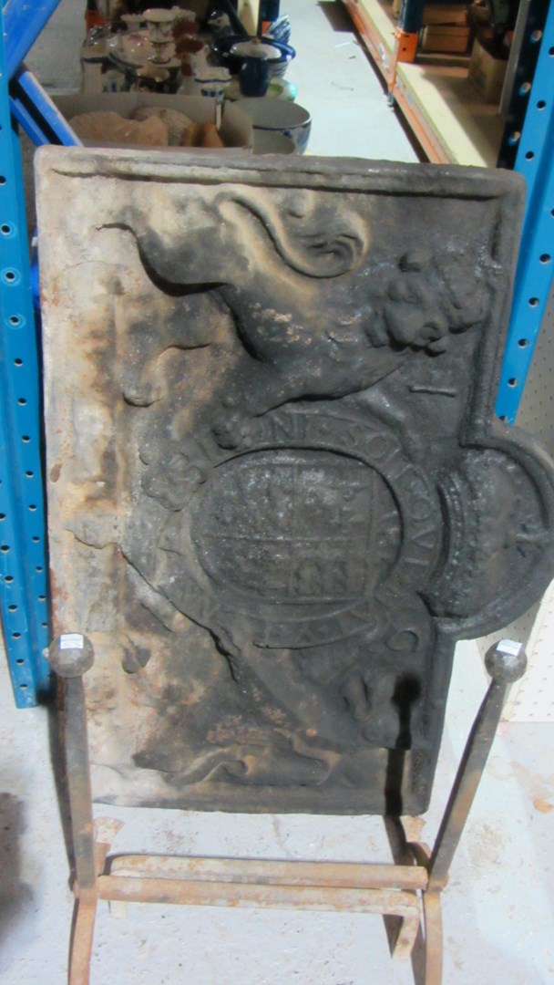 Appraisal: A large cast iron fire back together with a pair