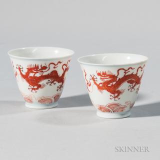 Appraisal: Near Pair of Iron Red Dragon Cups Near Pair of