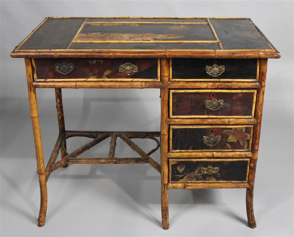 Appraisal: TORTOISE DECORATED BAMBOO DESK with worn inset leather surface -