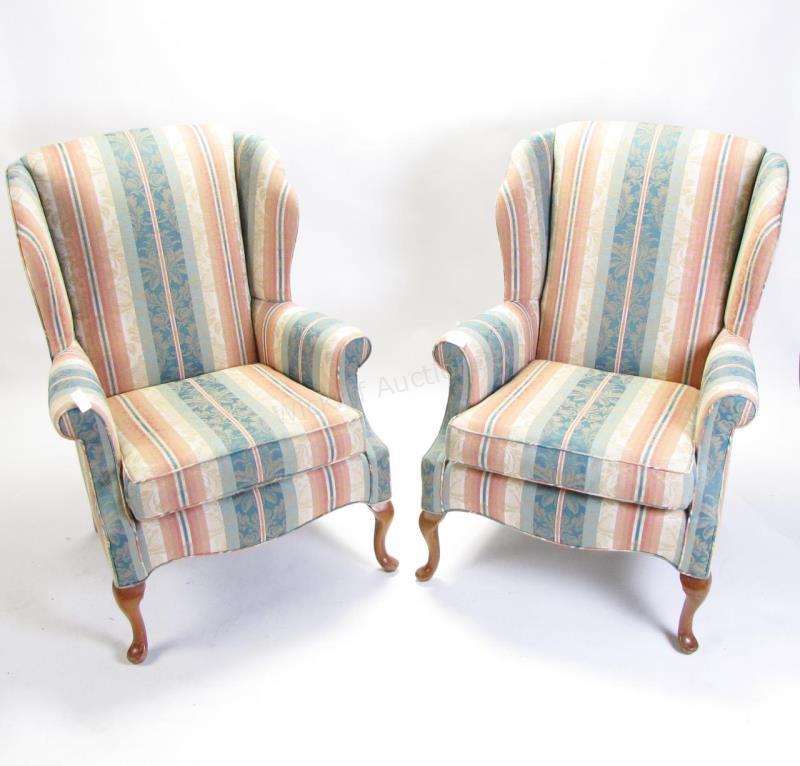 Appraisal: A pair of decorator fireside chairs Queen Anne style curved