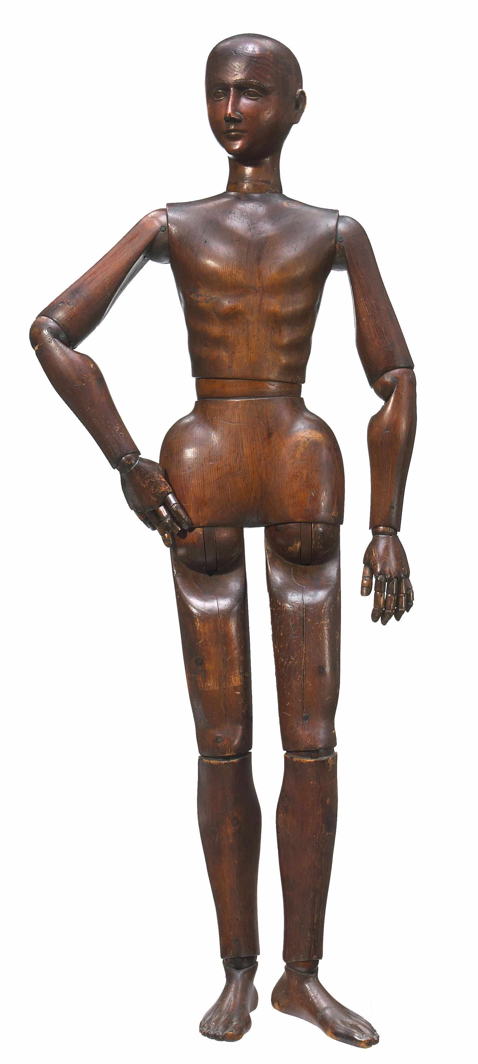 Appraisal: A near life-size stained and carved fruitwood articulated lay figure