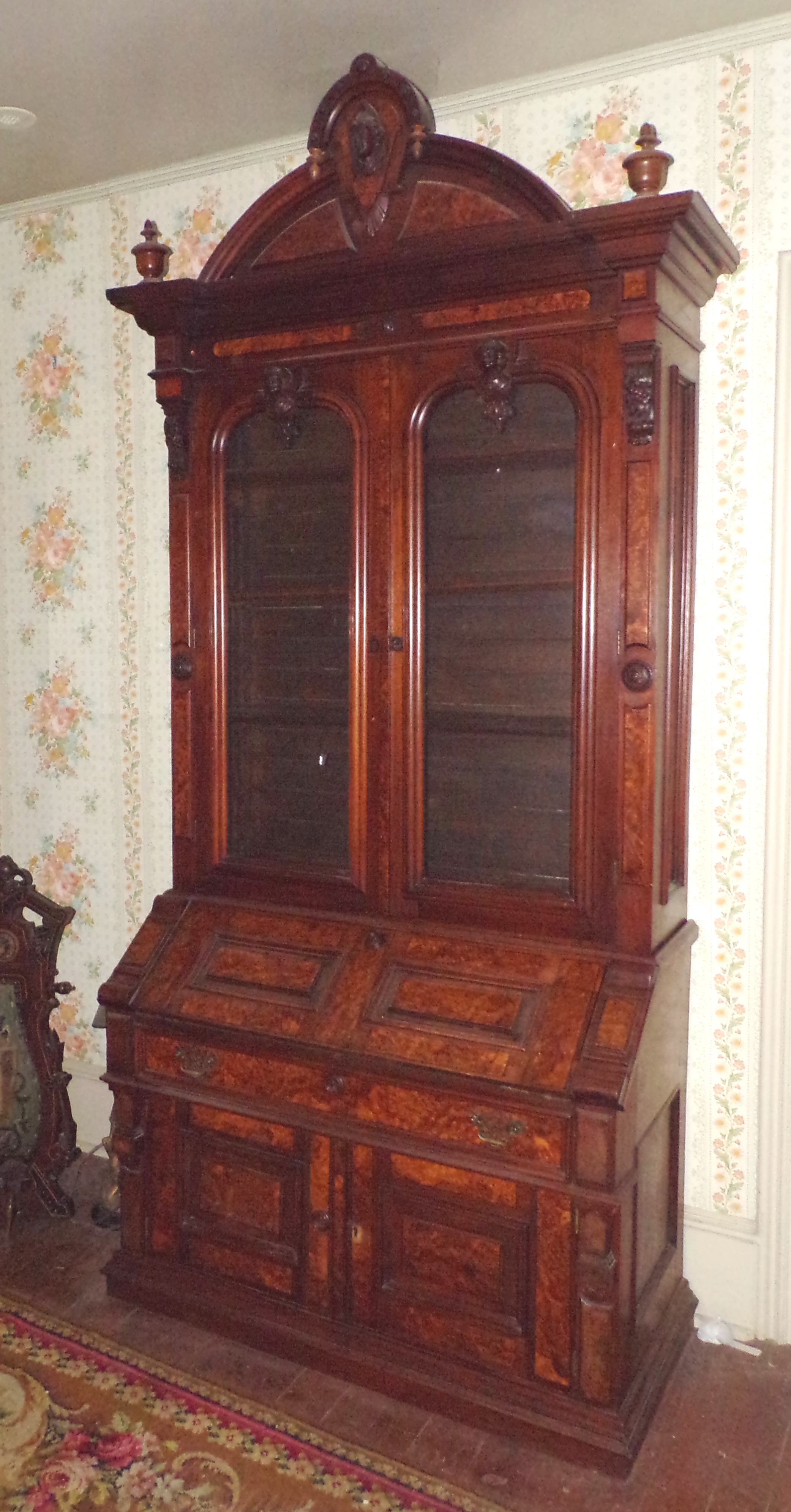 Appraisal: Victorian walnut Jelliff style secretary bookcase heavily decorated with numerous