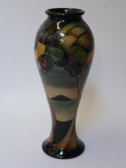 Appraisal: A MOORCROFT POTTERY VASE of slender inverted baluster form tube