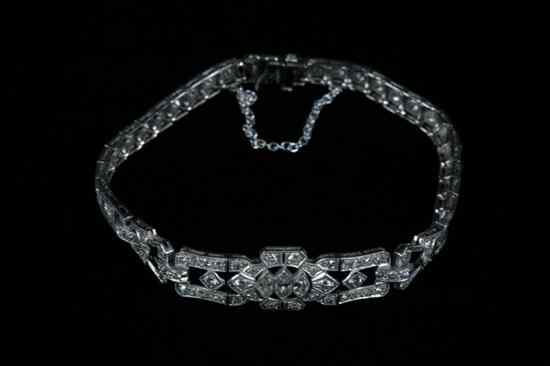 Appraisal: PLATINUM AND DIAMOND FLEXIBLE LINK BRACELET Circa Three marquise and