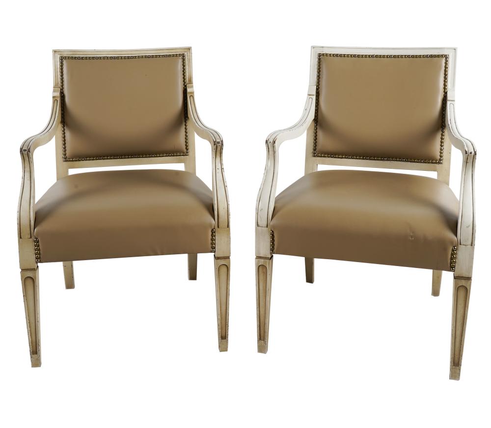 Appraisal: PAIR OF PAINTED OPEN ARMCHAIRSeach with studded leather upholstery inches