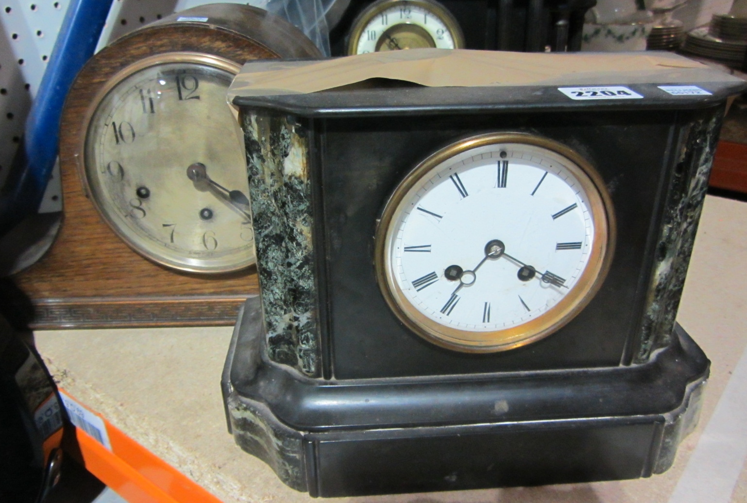 Appraisal: A slate cased mantel clock and a Napoleon shaped oak