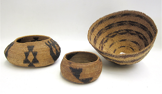 Appraisal: THREE NATIVE AMERICAN POMO WOVEN BASKETS the first a oval