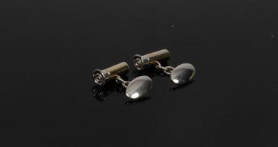 Appraisal: A pair of silver and silver gilt cufflinks of shotgun