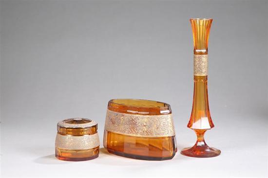 Appraisal: THREE PIECES OF MOSHER GLASS Amber color with brass bands