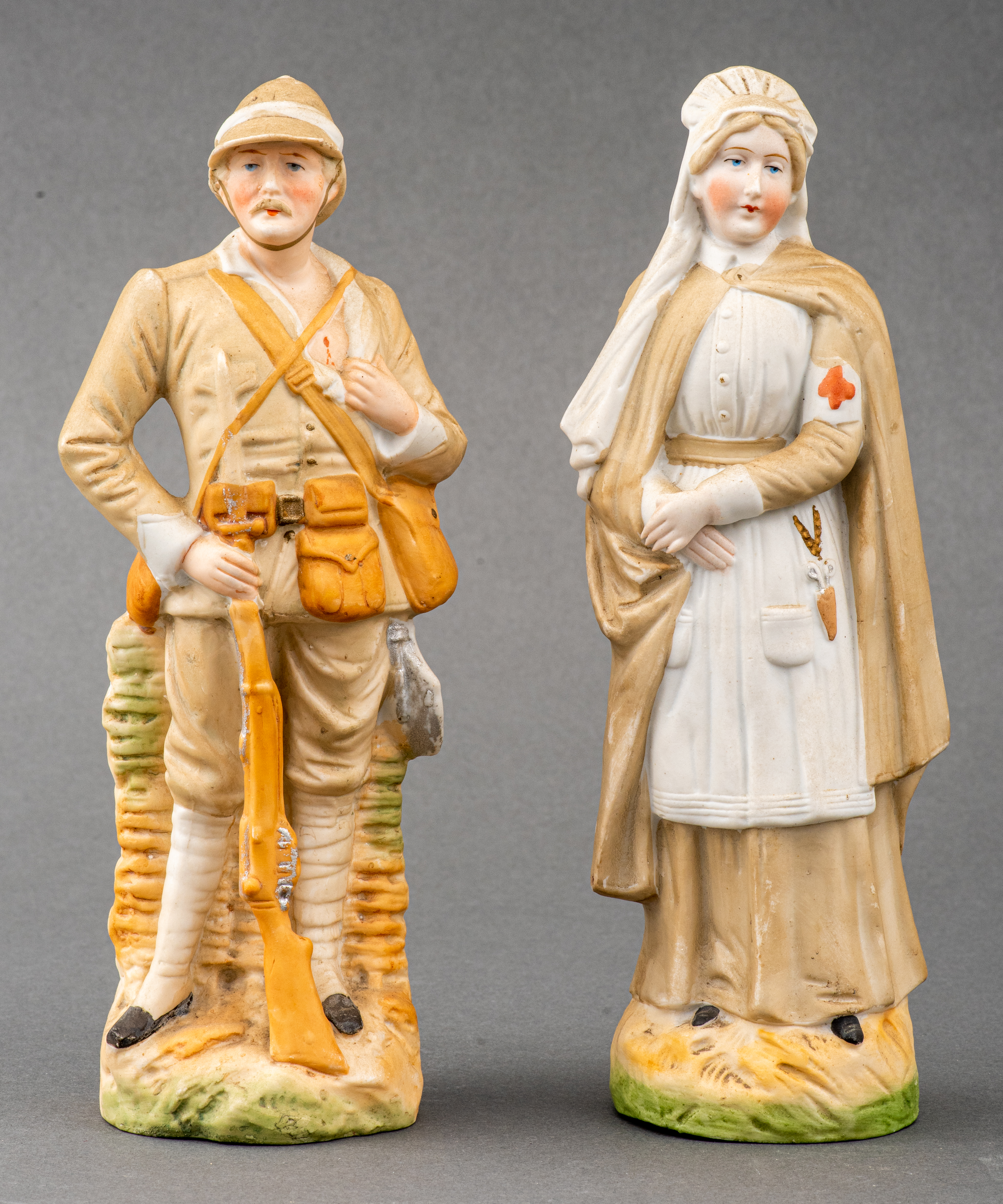 Appraisal: HAND PAINTED BISQUE PORCELAIN FIGURES Two hand-painted bisque porcelain figures