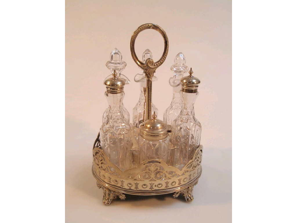 Appraisal: A Victorian silver plated six bottle cruet stand with cut