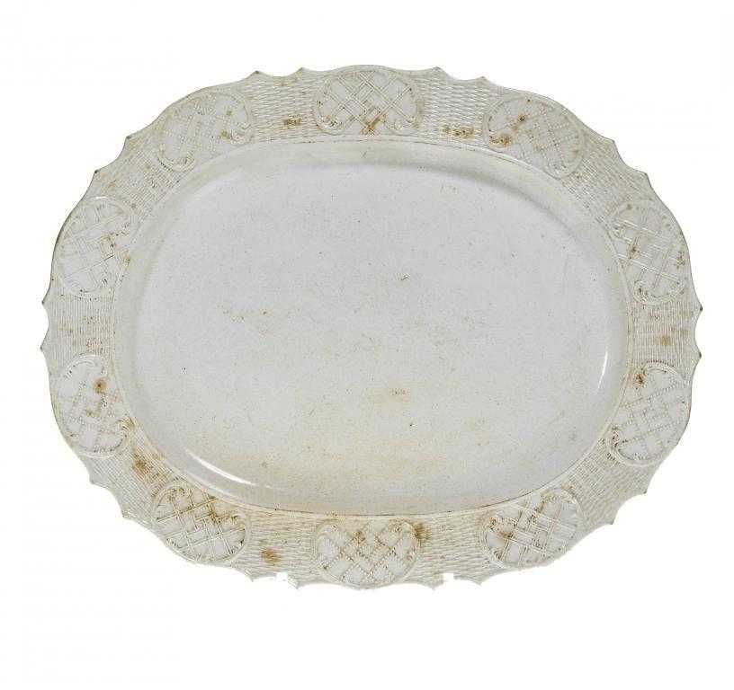 Appraisal: A COCKPIT HILL SALTGLAZED WHITE STONEWARE DISH the basket moulded