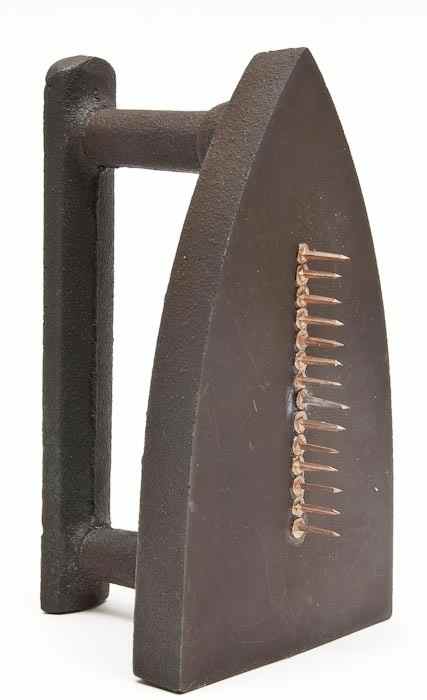 Appraisal: Man Ray - Cadeau cast iron multiple with copper nails