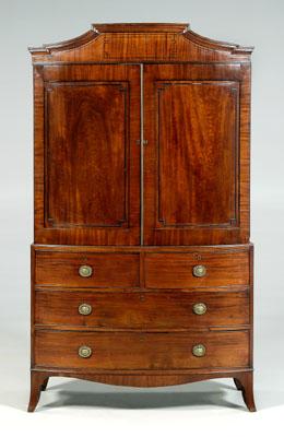 Appraisal: Fine Sheraton bow-front linen press mahogany veneers dovetailed construction with