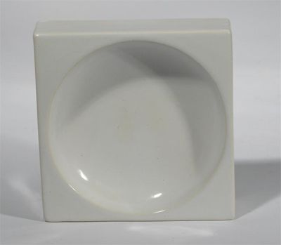 Appraisal: A Troika Pottery dish square section covered in a white