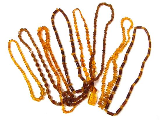 Appraisal: JEWELRY Eight amber necklaces from Poland three measuring '' l