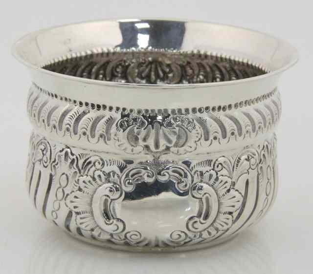 Appraisal: An embossed silver circular bowl JS S Birmingham fluted and