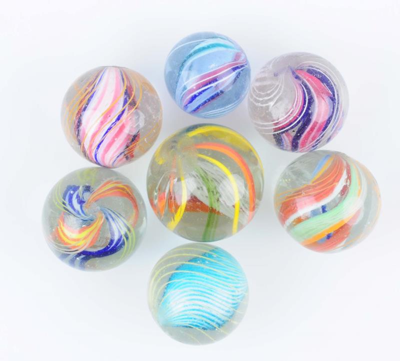 Appraisal: Lot Of Swirl Marbles Lot includes a three-stage solid core