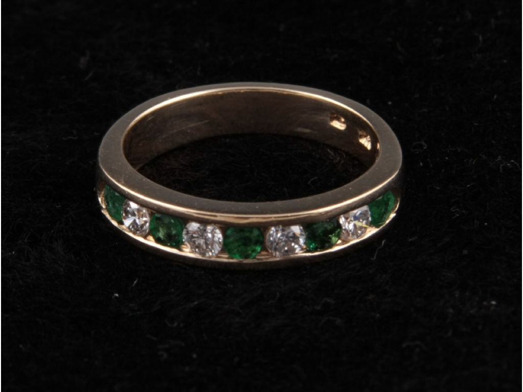 Appraisal: K Yellow Gold Emerald Diamond Band channel set band containing