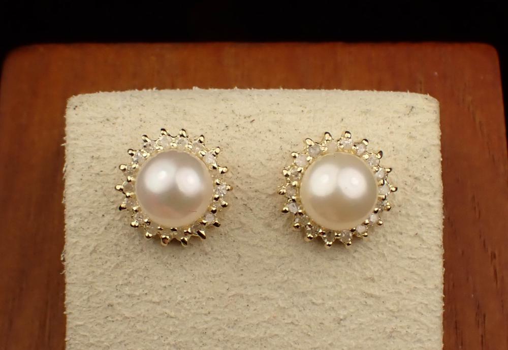 Appraisal: PAIR OF PEARL AND DIAMOND HALO EAR STUDS each yellow