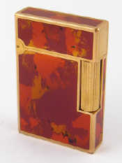 Appraisal: A gold plated Laque de Chine cigarette lighter by S