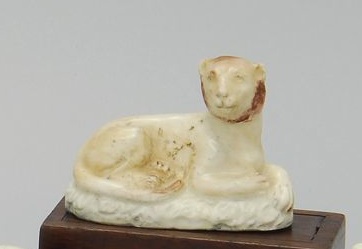 Appraisal: POLYCHROME PORCELAIN RECUMBENT LION Circa Length