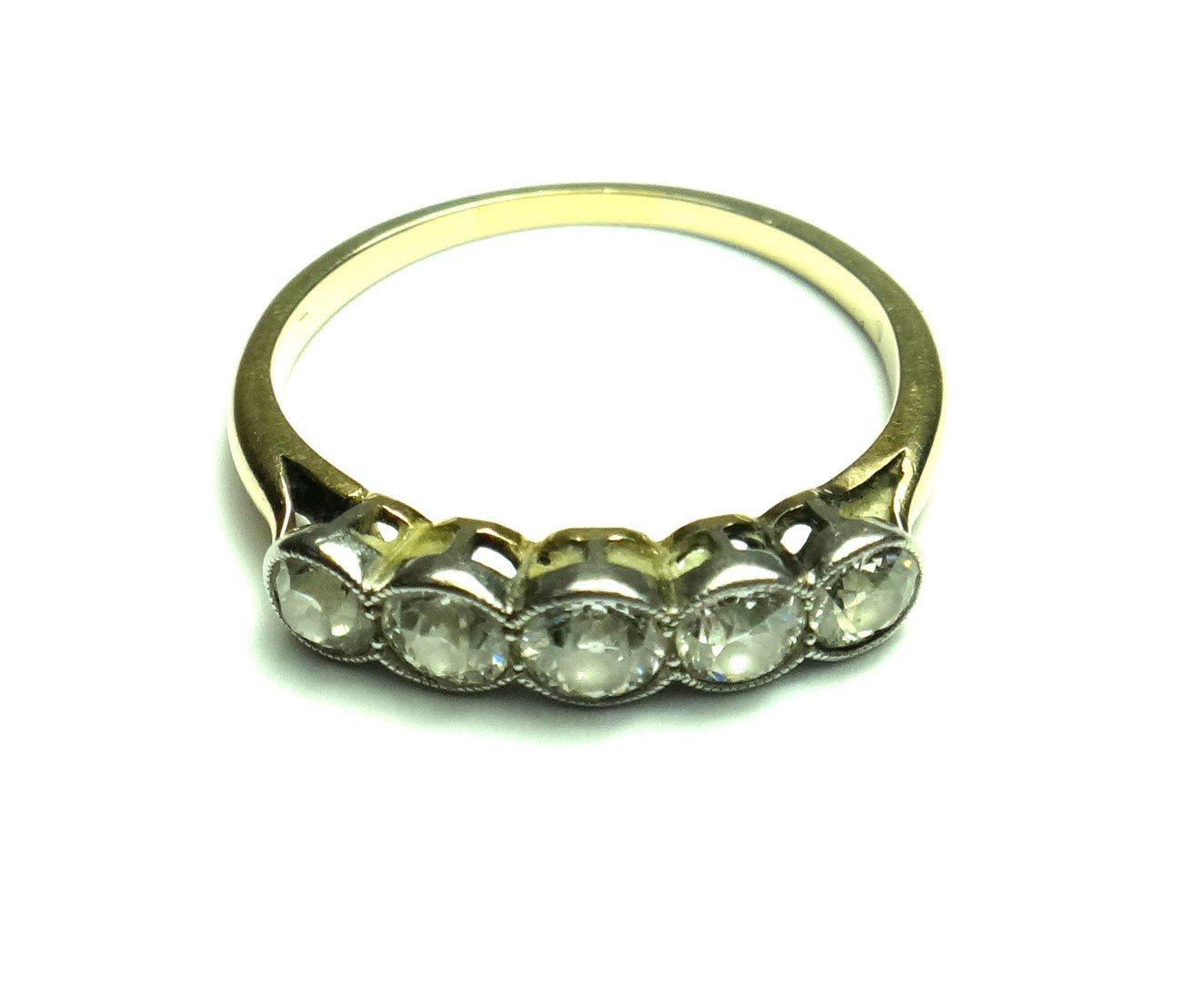 Appraisal: A gold and diamond set five stone ring mounted with