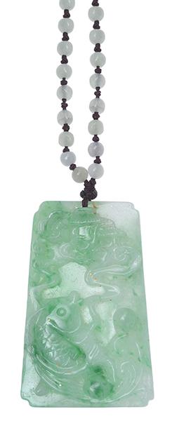 Appraisal: A JADEITE PENDANT NECKLACE The carved jadeite pendant of fish