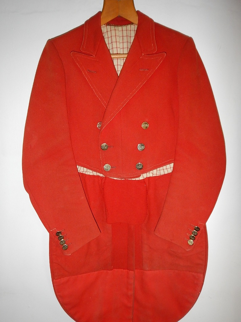 Appraisal: A vintage scarlet cutaway hunting coat with Quorn Hunt brass