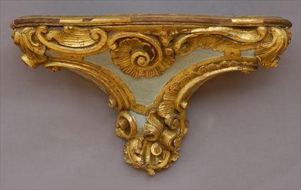 Appraisal: CONTINENTAL PAINTED AND PARCEL-GILT WALL BRACKET With interlocking c-scroll and