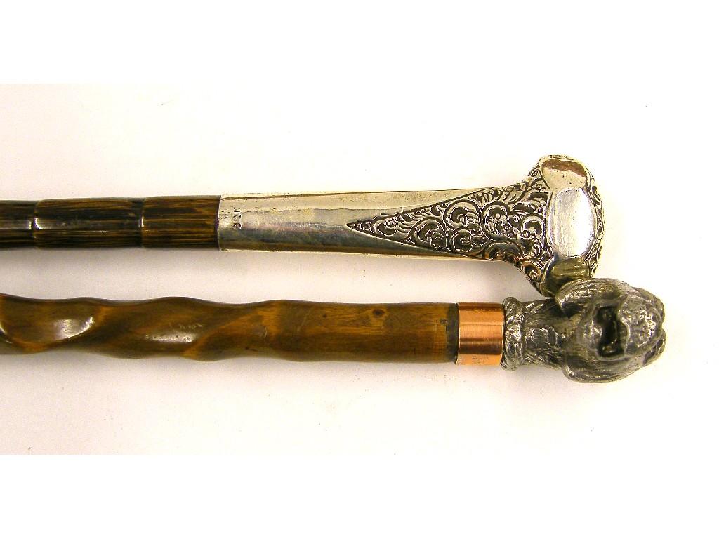 Appraisal: Silver topped walking cane and another walking cane with white