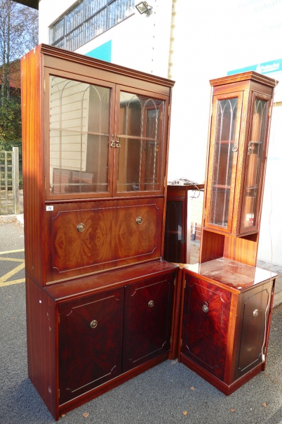 Appraisal: Reproduction mahogany cut corner display cabinet drop leaf with cabinets