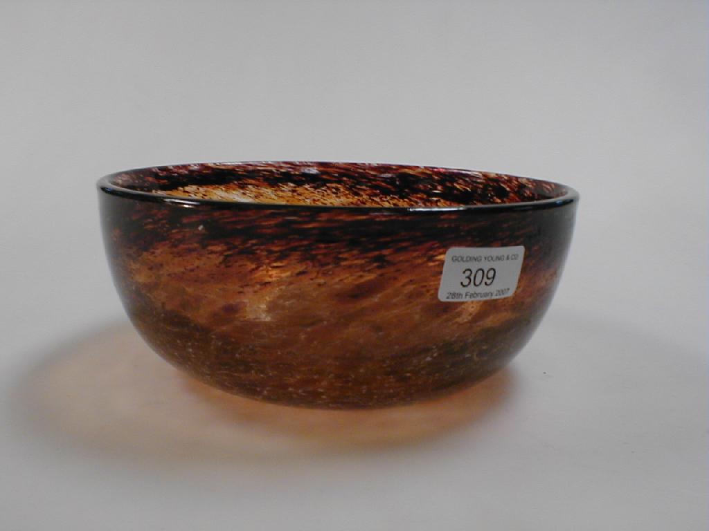 Appraisal: A large glass bowl in mottled browns and orange dia