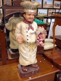 Appraisal: A painted timber statue of of cook